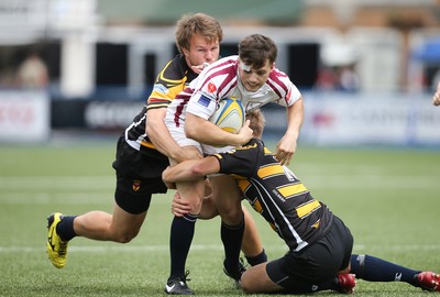 280816 - National Foster's 7s - Swansea's Jac Wilson is tackled by Geraint O'Driscoll and Arwel Robson during the match against Newport