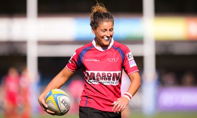 280816 - National Foster's 7s - Jess Kavanagh Williams of Scarlets is all smiles as she races in to score a second try in the semi final match against Blues