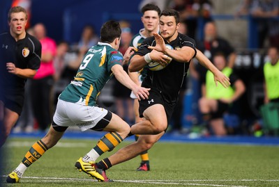 280816 - National Foster's 7s - Will Bryan of RGC 1404 looks for support as he is tackled by Adam Hoskins of Merthyr in the semi final of the Plate Competition