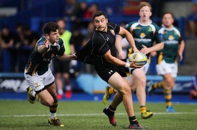 280816 - National Foster's 7s - Will Bryan of RGC 1404 looks for support as he is tackled by Adam Hoskins of Merthyr in the semi final of the Plate Competition