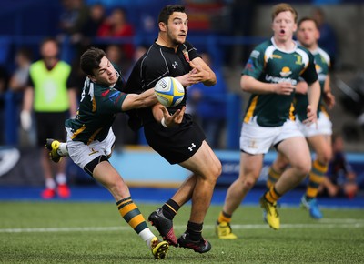 280816 - National Foster's 7s - Will Bryan of RGC 1404 looks for support as he is tackled by Adam Hoskins of Merthyr in the semi final of the Plate Competition