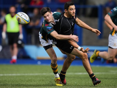 280816 - National Foster's 7s - Will Bryan of RGC 1404 looks for support as he is tackled by Adam Hoskins of Merthyr in the semi final of the Plate Competition