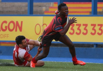 280816 - National Foster's 7s, Cup Final - Aberavon's Mike Wilson is tackled by Aron Evans of Llandovery