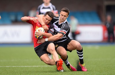 300815 - Fosters national 7s 2015 -Dan White of Cross Keys is tackled by Andy Evans of Bedwas