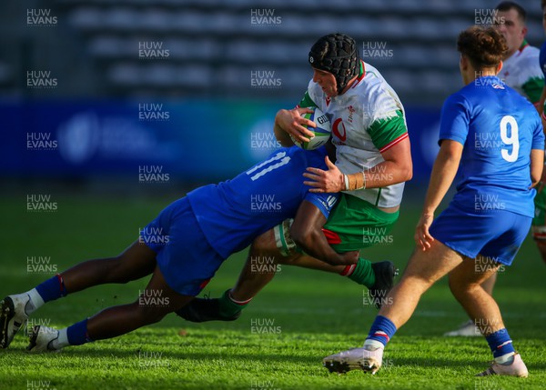 040723 - France v Wales - World Rugby U20 Championship - Jonny Green of Wales is tackled by Mael Moustin of France