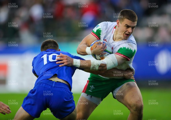 040723 - France v Wales - World Rugby U20 Championship - Bryn Bradley of Wales is tackled by Clement Mondinat of France