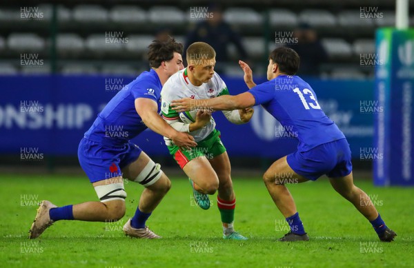 040723 - France v Wales - World Rugby U20 Championship - Cameron Winnett of Wales is tackled by Maxence Biasotto of France
