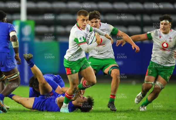 040723 - France v Wales - World Rugby U20 Championship - Cameron Winnett of Wales tries to break free from a tackle