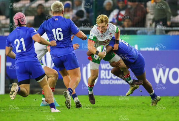 040723 - France v Wales - World Rugby U20 Championship - Harrie Houston of Wales is tackled 