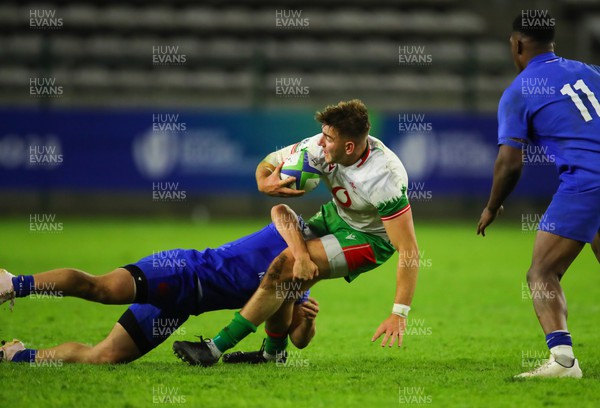 040723 - France v Wales - World Rugby U20 Championship - Tom Florence of Wales is tackled