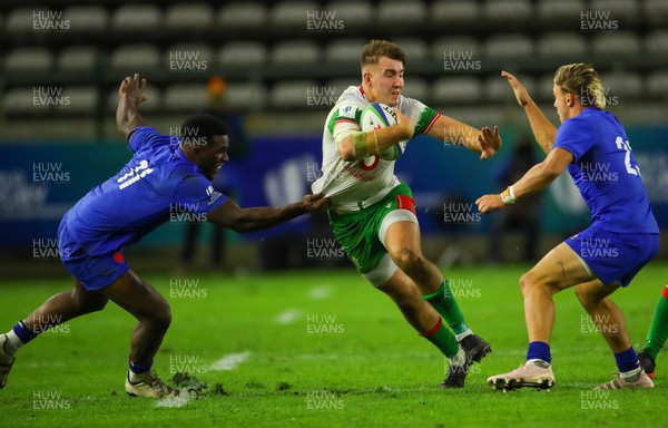 040723 - France v Wales - World Rugby U20 Championship - Tom Florence of Wales runs into Mael Moustin of France and Paul Costes of France