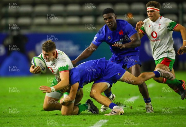 040723 - France v Wales - World Rugby U20 Championship - Tom Florence of Wales is tackled
