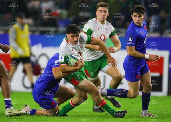 040723 - France v Wales - World Rugby U20 Championship - Harri Wilde of Wales is tackled 