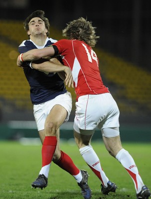 19.03.11 - France U20 v Wales U20 - Under 20 Six Nations - Jean-Pascal Baraque of France is tackled by LIam William of Wales. 