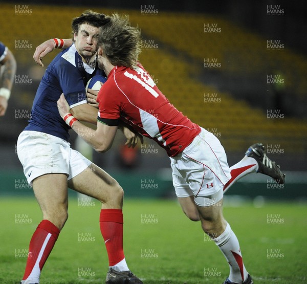 19.03.11 - France U20 v Wales U20 - Under 20 Six Nations - Jean-Pascal Baraque of France is tackled by LIam William of Wales. 