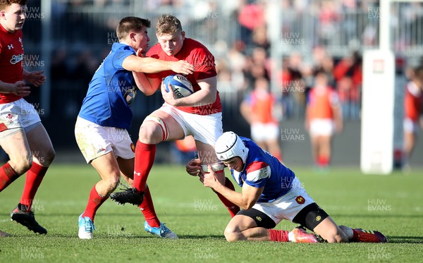030219 - France U20s v Wales U20s - U20s 6 Nations Championship - Jac Morgan of Wales is tackled by Louis Carbonel and Vincent Pinto of France
