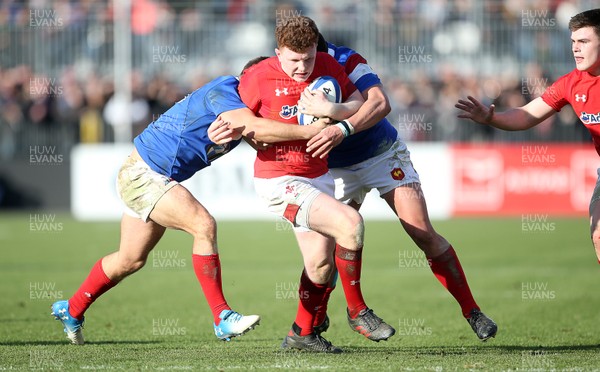030219 - France U20s v Wales U20s - U20s 6 Nations Championship - Aneurin Owen of Wales is tackled by Louis Carbonel and Julien Delbouis of France