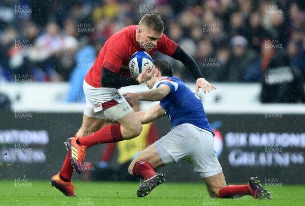 010219 - France v Wales - Guinness 6 Nations 2019 - Gareth Anscombe of Wales is tackled by Morgan Parra of France