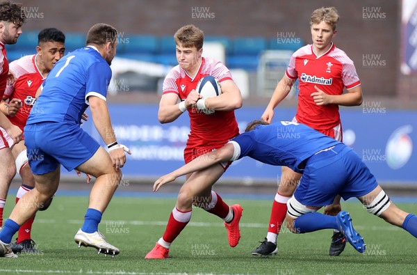 010721 - France v Wales - U20s 6 Nations Championship - Jacob Beetham of Wales is tackled by Thomas Ployet of France