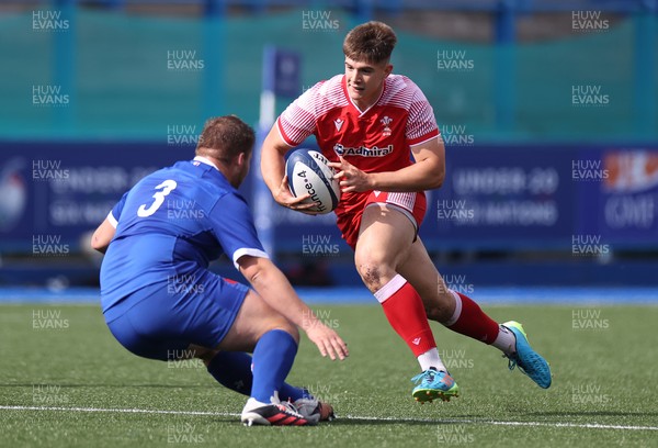 010721 - France v Wales - U20s 6 Nations Championship - Joe Hawkins of Wales is tackled by Paul Mallez of France