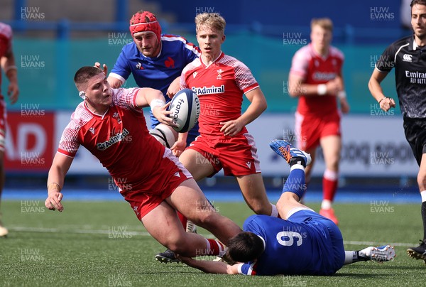 010721 - France v Wales - U20s 6 Nations Championship - Oli Burrows of Wales is tackled by Nolann Le Garrec of France