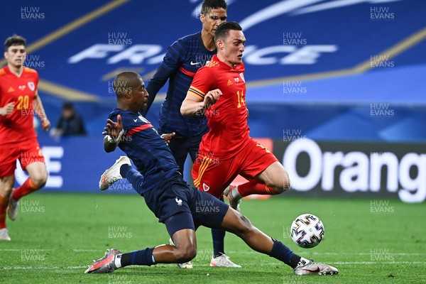 020621 - France v Wales - International Friendly - Connor Roberts of Wales is tackled by Presnel Mimpembe of France