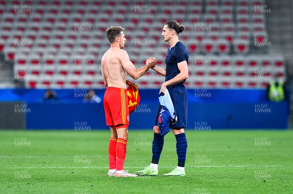 020621 - France v Wales - International Friendly - Aaron Ramsey of Wales and Adrien Rabiot of France exchange shirts