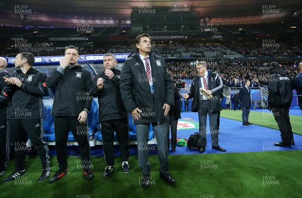 101117 - France v Wales - International Friendly - Wales Manager Chris Coleman and staff sing the anthem