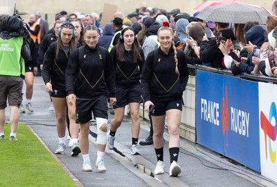 120425 - France v Wales, Guinness Women’s Six Nations 2025 - Hannah Jones of Wales and Jasmine Joyce of Wales lead the team as they arrive at the stadium