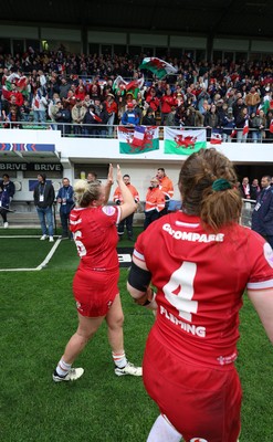 120425 - France v Wales, Guinness Women’s Six Nations 2025 - Abbie Fleming of Wales and Kelsey Jones of Wales applaud the fans at the end of the match