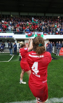 120425 - France v Wales, Guinness Women’s Six Nations 2025 - Abbie Fleming of Wales and Kelsey Jones of Wales applaud the fans at the end of the match