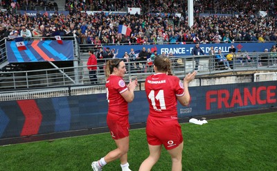 120425 - France v Wales, Guinness Women’s Six Nations 2025 - Courtney Keight of Wales and Carys Cox of Wales applaud the French supporters at the end of the match