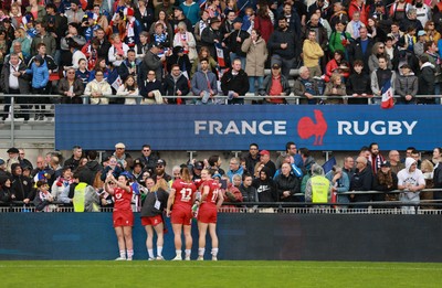 120425 - France v Wales, Guinness Women’s Six Nations 2025 - Wales players sign autographs for French supporters at the end of the match