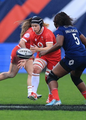 120425 - France v Wales, Guinness Women’s Six Nations 2025 - Bethan Lewis of Wales takes on Madouddou Fall-Raclot of France