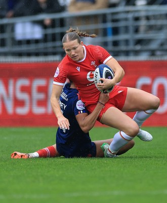 120425 - France v Wales, Guinness Women’s Six Nations 2025 - Carys Cox of Wales is tackled