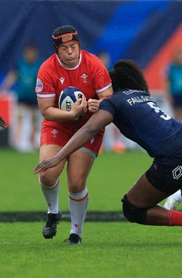 120425 - France v Wales, Guinness Women’s Six Nations 2025 - Carys Phillips of Wales takes on Madouddou Fall-Raclot of France
