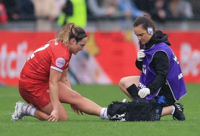 120425 - France v Wales, Guinness Women’s Six Nations 2025 - Cara Jones, Medic treats Courtney Keight of Wales
