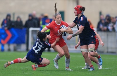 120425 - France v Wales, Guinness Women’s Six Nations 2025 - Carys Cox is tackled by Oceane Bordes of France