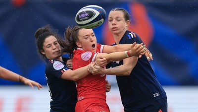 120425 - France v Wales, Guinness Women’s Six Nations 2025 - Sian Jones of Wales is held by Oceane Bordes of France and Marine Menager of France