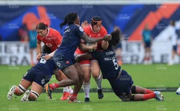 120425 - France v Wales, Guinness Women’s Six Nations 2025 - Carys Phillips of Wales is held