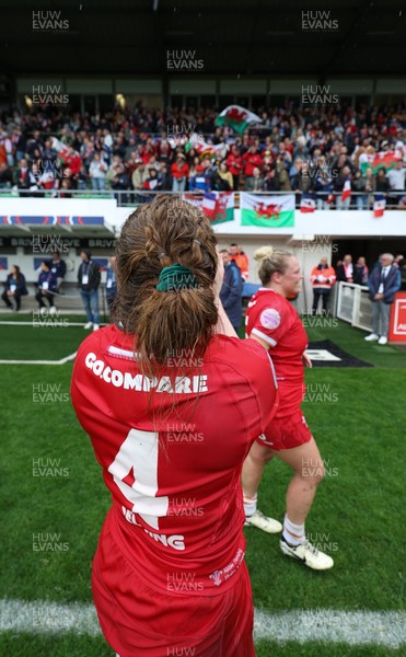 120425 - France v Wales, Guinness Women’s Six Nations 2025 - Abbie Fleming of Wales and Kelsey Jones of Wales applaud the fans at the end of the match