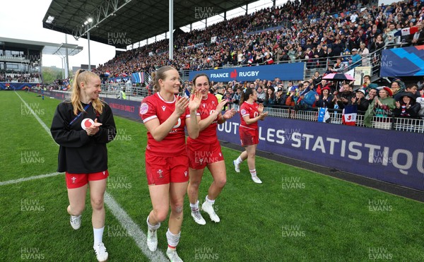 120425 - France v Wales, Guinness Women’s Six Nations 2025 - Cath Richards, Kayleigh Powell of Wales, Courtney Keight of Wales and Carys Cox of Wales applaud the French supporters at the end of the match