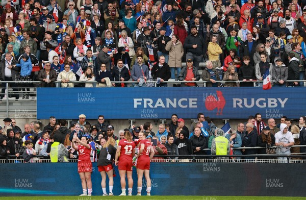 120425 - France v Wales, Guinness Women’s Six Nations 2025 - Wales players sign autographs for French supporters at the end of the match