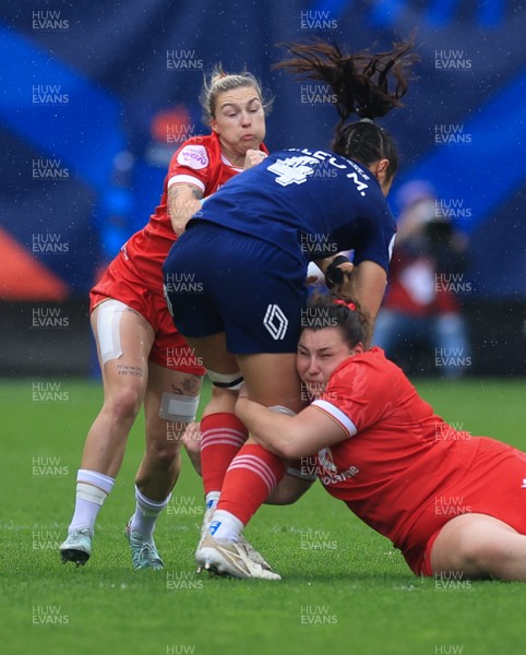 120425 - France v Wales, Guinness Women’s Six Nations 2025 - Keira Bevan of Wales and Gwenllian Pyrs of Wales tackle Manae Feleu of France