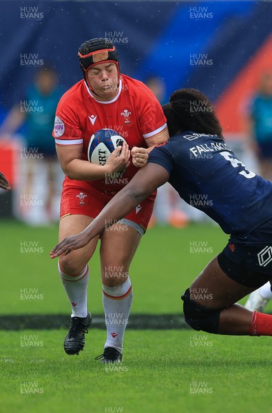 120425 - France v Wales, Guinness Women’s Six Nations 2025 - Carys Phillips of Wales takes on Madouddou Fall-Raclot of France