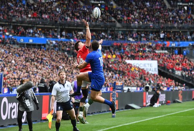 180323 - France v Wales - Guinness Six Nations - Josh Adams of Wales gets the ball back into play