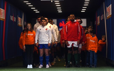 180323 - France v Wales - Guinness Six Nations - Antoine Dupont of France and Taulupe Faletau of Wales lead out their sides