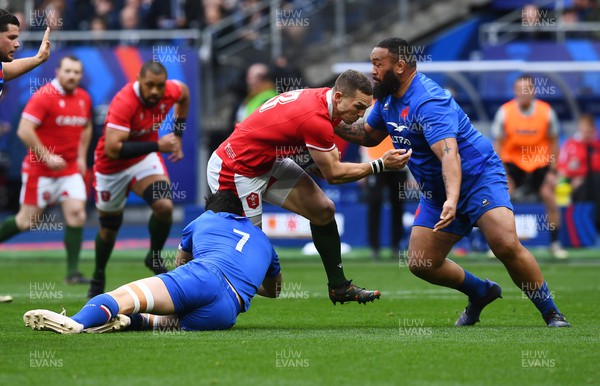 180323 - France v Wales - Guinness Six Nations - George North of Wales is tackled by Charles Ollivon and Uini Atonio of France 