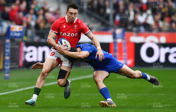 180323 - France v Wales - Guinness Six Nations - Josh Adams of Wales is tackled by Ethan Dumortier of France 