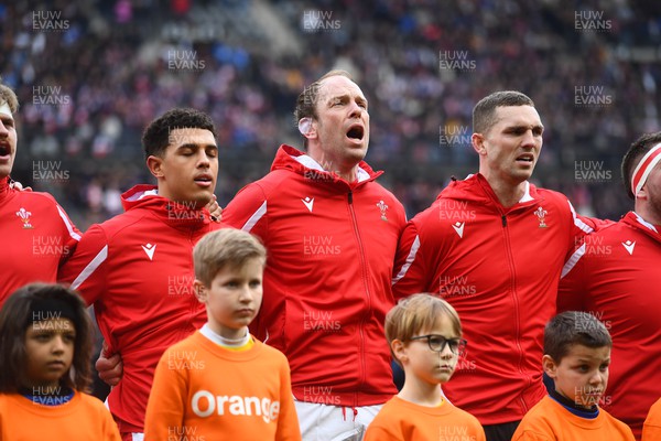 180323 - France v Wales - Guinness Six Nations - Rio Dyer, Alun Wyn Jones and George North of Wales sing the anthem